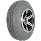 Angled view of the 2.80/2.50-4 Merits Foam Filled Caster Wheel for Atlantis and Travel-Ease Commuter Wheelchair showing sawtooth gray tread