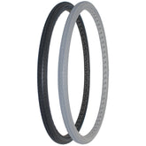 Angled view of 24 x 1 3/8 in. (37-540) Solid Urethane Orion Wheelchair Tire with P163 Street Tread in black and gray