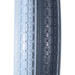 Close up view of the 24 x 1 3/8 in. (37-540) primo Urethane Orion Wheelchair Tire in black and gray