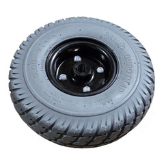 Angled view of the 3.00-4 Pr1mo Durotrap Drive Wheel For The Jazzy Select 6 features an assembled gray tire and 7 spoke rim. Pride Mobility part WHLASMB1728