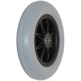 Angled view of the 6 x 1 in. Eight Spoke Anti-Tip Caster Wheel for Pride Wheelchairs showing gray ribbed urethane tread