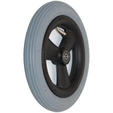 8 x 1 1/4 in. Primo Hollow Spoke Pneumatic Wheelchair Caster Wheel - Angled view showing schrader valve