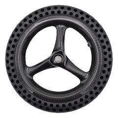 Bottom view of the replacement 10.71-inch drive wheel assembly for Pride Jazzy Ultra Light power chair. Flat-free perforated tire with carbon fiber 3-spoke rim. Pride WHL2400187.