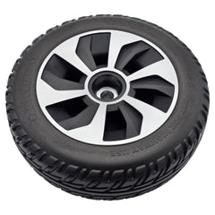 Angled view of the replacement black 10x3 drive wheel assembly for Pride Jazzy Air 2 and Jazzy Air MED power wheelchairs. Pr1mo P-126 non-marking tire, spoke rim, fully assembled.