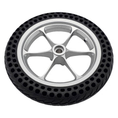 Front view of the replacement 11.25 inch black rear drive wheel assembly for Pride Jazzy Passport power chair with silver spoke rim
