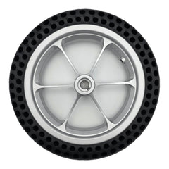 Top view of the replacement 11.25 inch rear drive wheel assembly for Pride Jazzy Passport power chair with silver spoke rim showing 12x2.0 marking