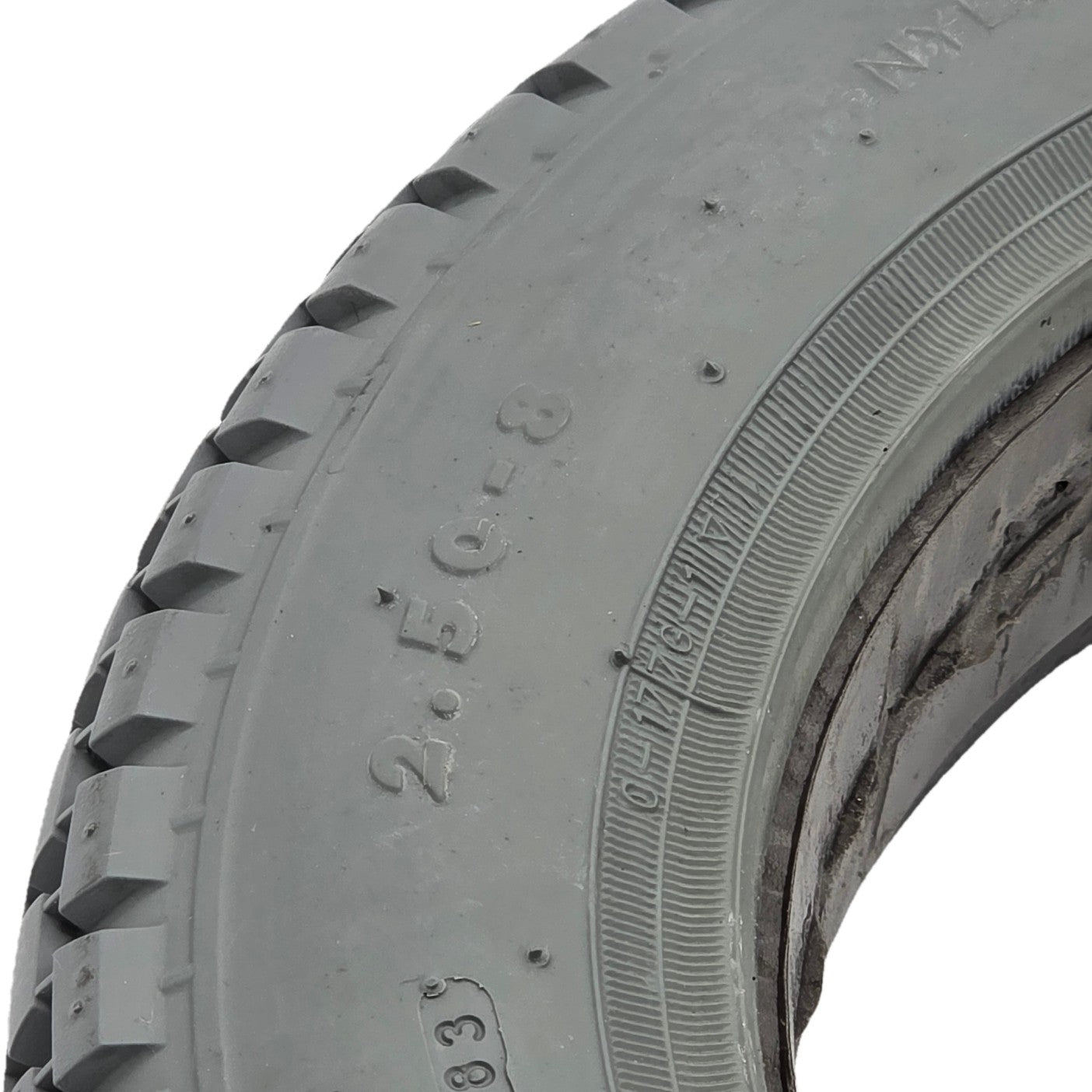 Close up view of the 2.50-8-Primo-Power-Plant-Foam-Filled-Wheelchair-Tire close up showing gray C-177G tread