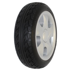 Angled view of the 228x70 Invacare Pronto P31 Drive Wheel Assembly 1186182 showing silver rim with black tire