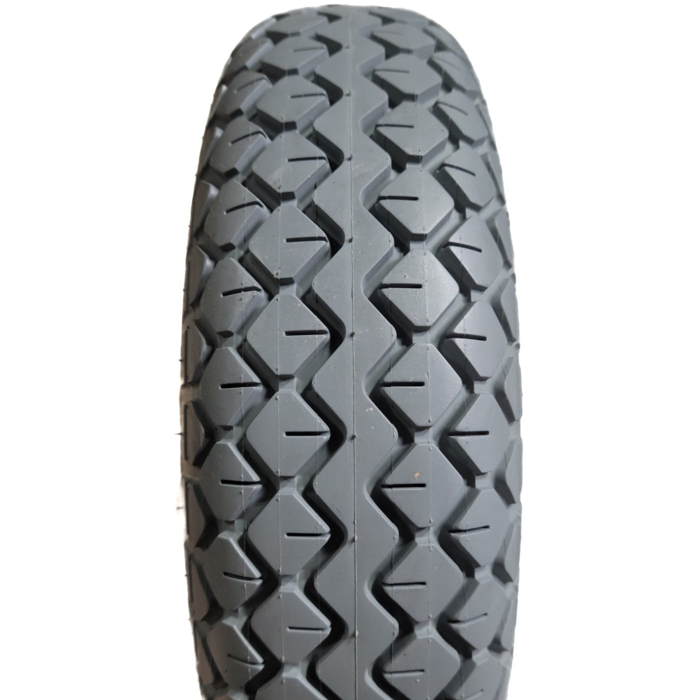 Close up view of 4.00-5 Diamond Foam Filled Wheelchair and Scooter Tire showing gray diamond pattern tread