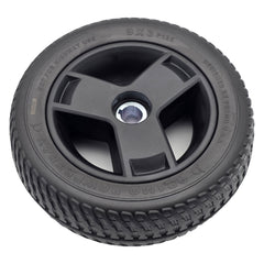 Close up view of the 9x3 Pr1mo Powertrax Drive Wheel for Pride Go Chair Med Power Chair features an assembled black tire and 3 spoke rim for easy install.