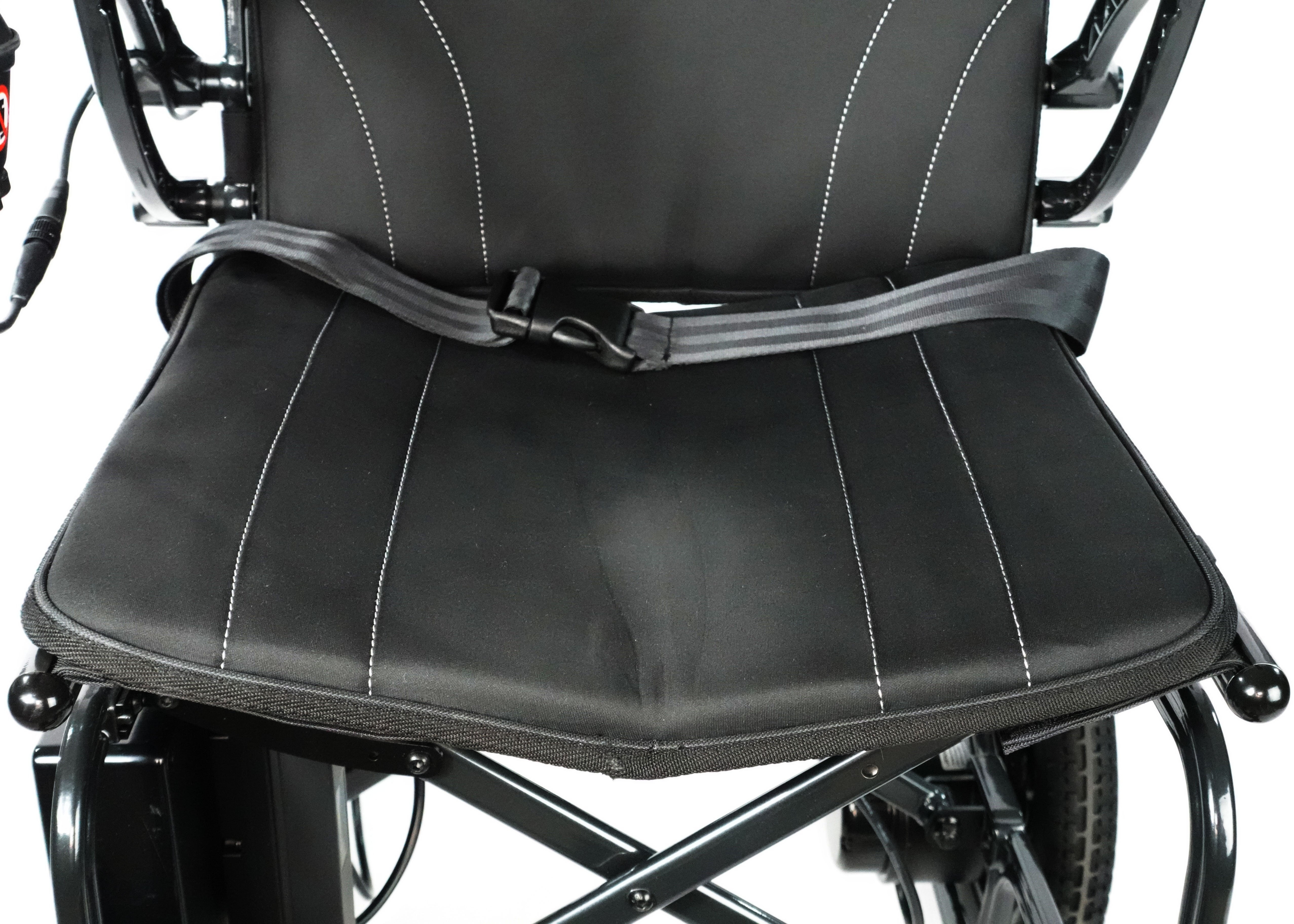 Experience unmatched freedom with the Air 2026 Lightweight Folding Power Chair by Journey Health. Redesigned with larger wheels, powerful brushless motors, and foldable for easier transport. Showing black seat upholstery and seat belt