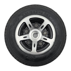 Close up view of the replacement Drive Wheel Assembly for Merits Vision CF Wheelchair features a stylish silver rim with a 2.80/2.50-4 black flat free tire.