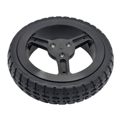 Close up view of the Drive Wheel for Pride Jazzy Carbon Power Wheelchair (215x50) and Rascal Carbon Cruiser. Features black Flat-free tire with 3-spoke rim.
