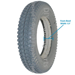 3.00-8 (14 x 3 in.) Primo Powertrax heavy duty foam filled solid flat free electric wheelchair tire, C248 knobby tread pattern, in gray color.