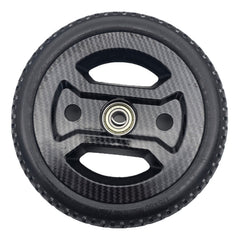 Front view of the replacement 175x50 Front Wheel Assembly for Pride Go Go Carbon Electric Scooter. Black carbon fiber wheel fits the left or right side wheels. Showing included bearings