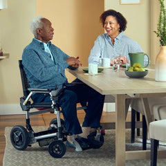 Experience unmatched freedom with the portable lightweight Zoomer Electric Folding Power Chair by Journey Health. Fits under tables